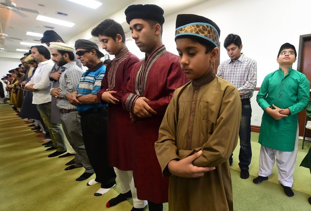 Muslims pray while celebrating Eid al-Fitr, marking the end of fasting during the month-long Ramadan, at the Baitul Hameed Mosque in Chino, California on July 6, 2016. The Pew Research center estimated earlier this year there were about 3.3 million Muslims of all ages living in the United States in 2015. / AFP / Frederic J. BROWN (Photo credit should read FREDERIC J. BROWN/AFP/Getty Images)